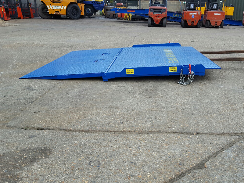 low-level loading ramps lies on the concrete of the yard