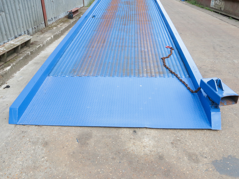 close-up on used blue loading ramp standing on the yard
