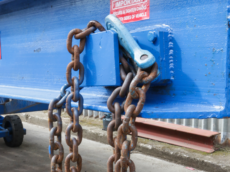 close-up on the blue loading ramp chain