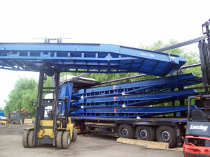 blue standard mobile container loading ramp on the industrial yard